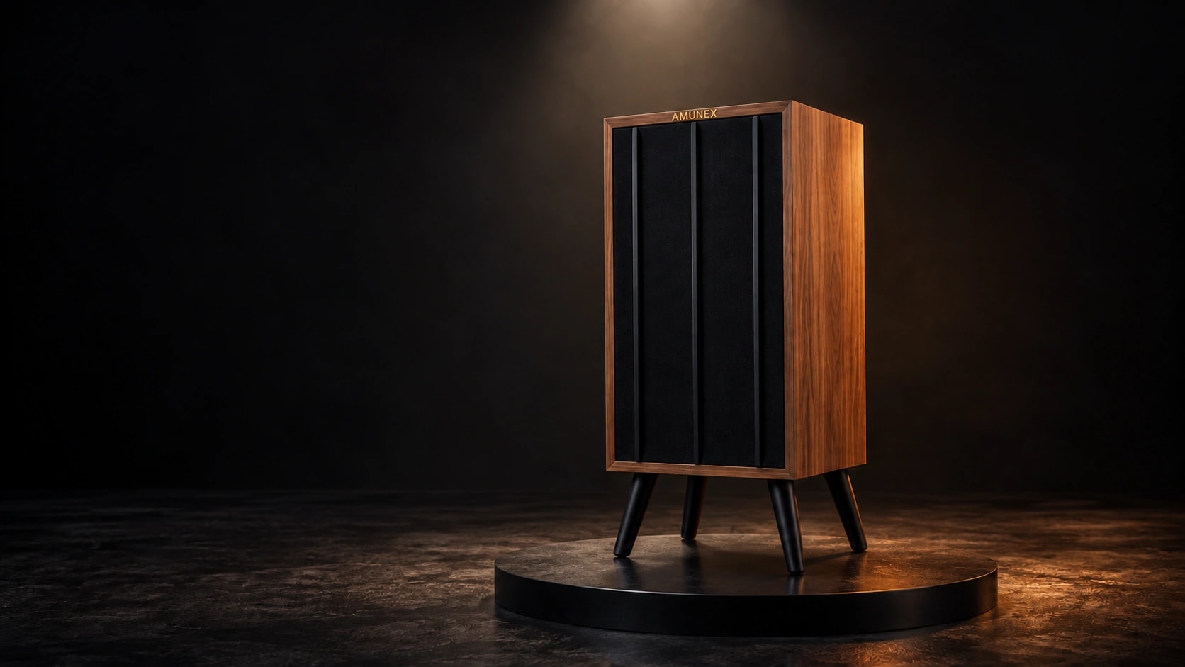AMUNEX AX1 walnut speaker with black grille and matte black legs under dramatic studio lighting